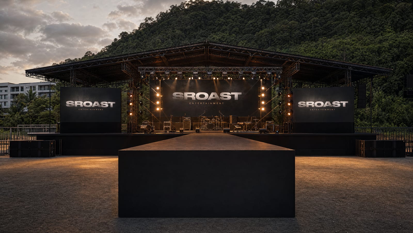 Redtix Stage at sunset — full L-Acoustics K3 rig, 45 m² LED wall, audience pit. The room in showtime light.